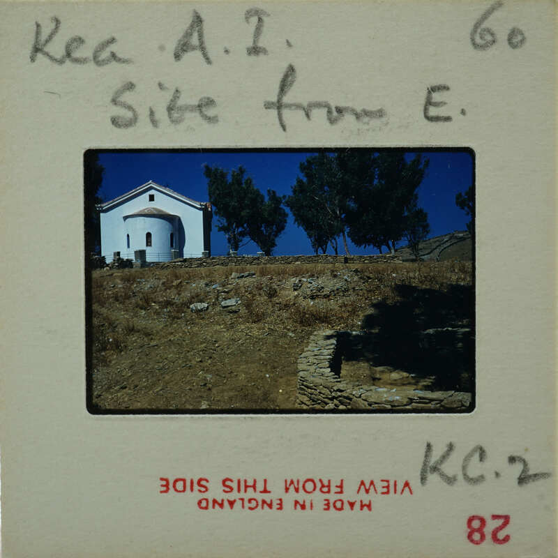 A vintage postcard with a photo of a church on a hilltop, featuring handwritten notes and stamps.
