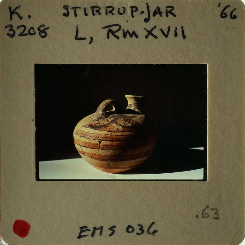 Ancient Greek vase with figures on display.