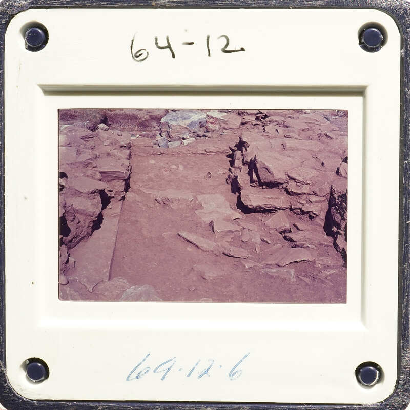 Old photograph of rocks with a white border and date stamp.