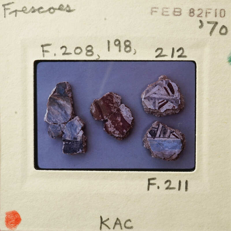 A collection of small, colorful rocks with various patterns and textures.