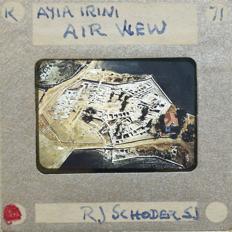 Aerial photograph of a fortified island with buildings and waterways.