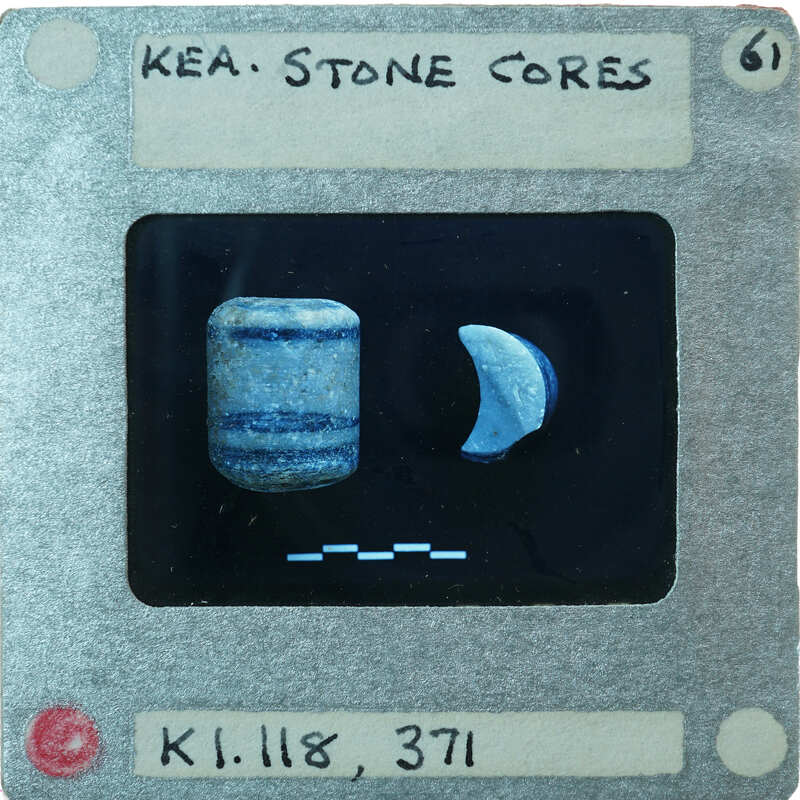 Two small cylindrical stone objects, one broken, K1.118, K1.371.