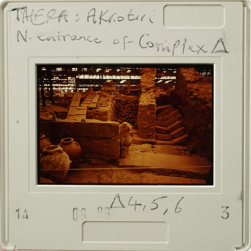 Ancient ruins with stone steps and columns, captured on a vintage film strip.