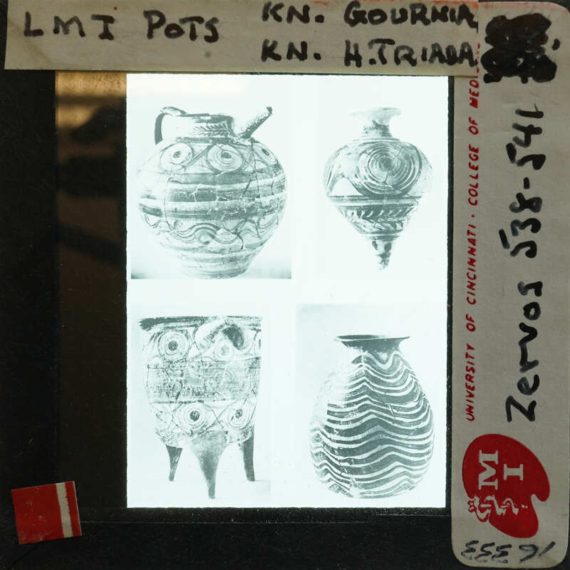 Photo of printed volume showing four large pots witn intricate designs.