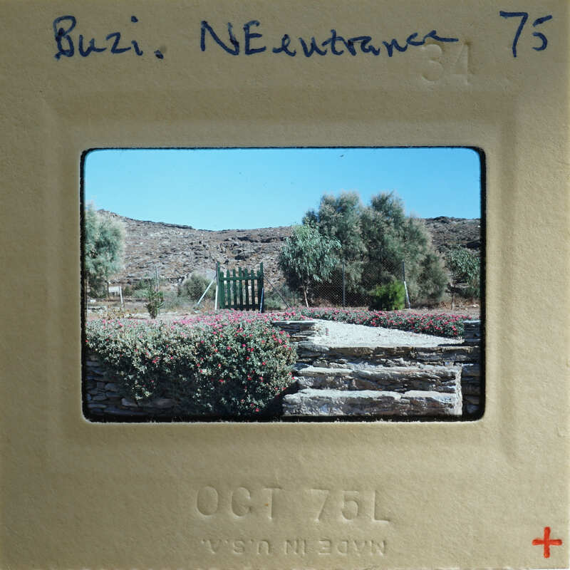 A vintage photograph of a garden with stone steps and greenery, dated October 1976.