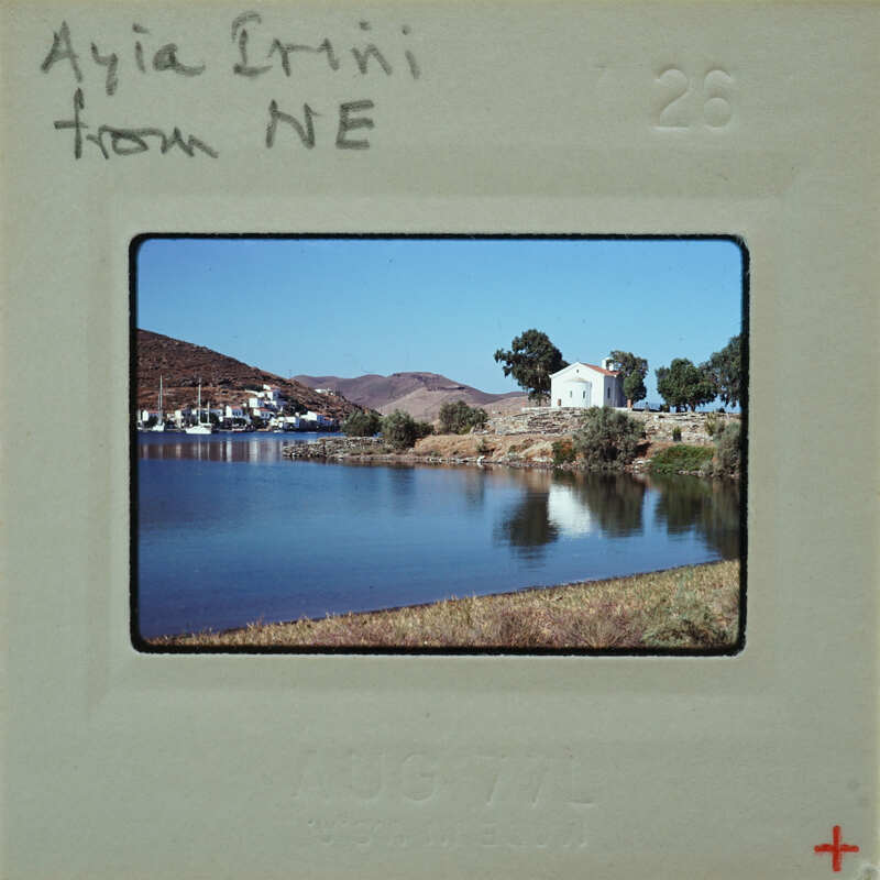 A vintage photo of a scenic lake with mountains and boats, labeled "AIAI CINNI NE" from August 7th.