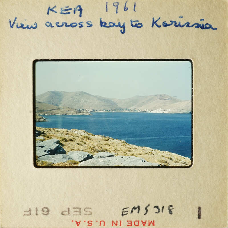 Landscape view with mountains and water, possibly from an old travel photo.