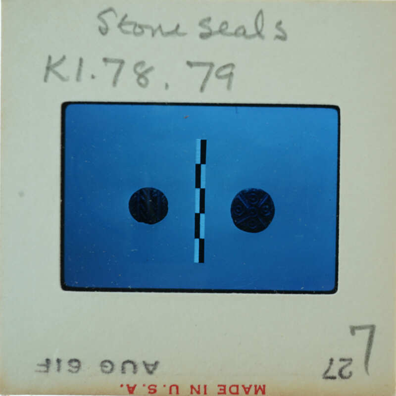 Blue and white label with a barcode, numbers, and symbols on it.