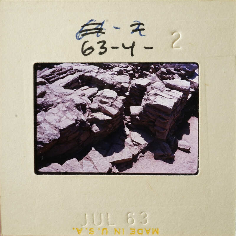 Old photograph of a rocky landscape with a film strip label indicating July 1963.