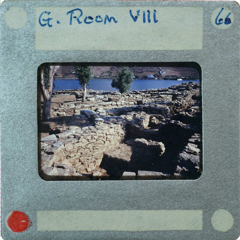 A vintage photo of an archaeological site with ruins and a body of water, labeled "G. Room VII" on the film strip.