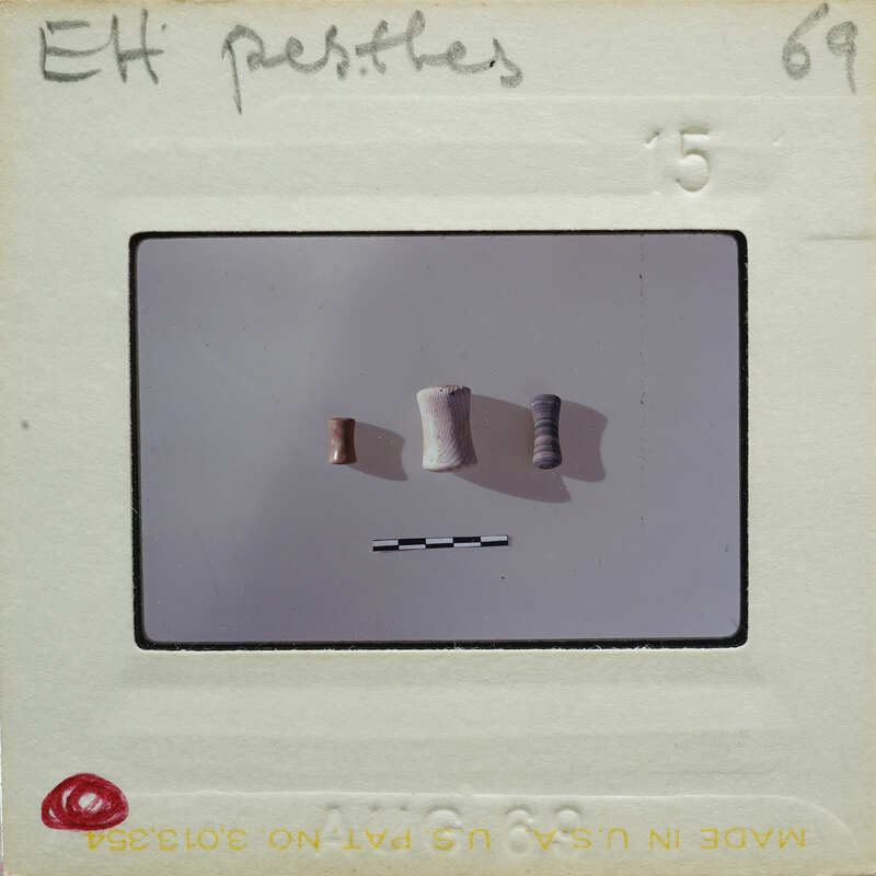 Three cylindrical items on table.