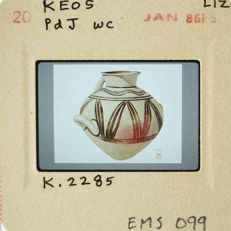 The image shows an antique vase with intricate designs, displayed against a white background.