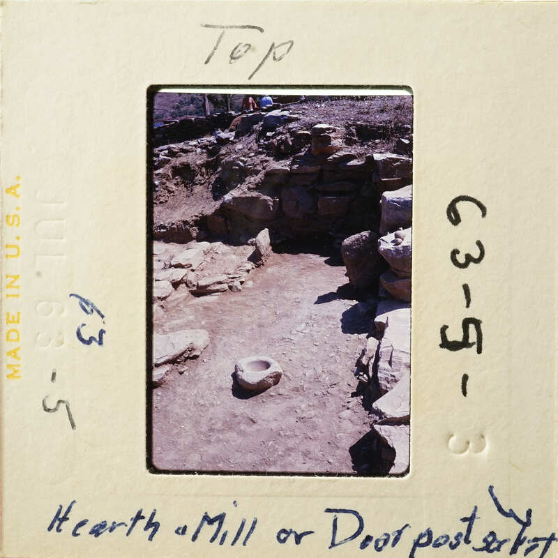 Archaeological site with stone ruins and artifacts.