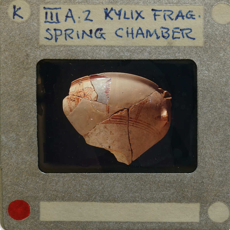 Partially reassembled kylix with a label indicating it is from the Spring Chamber.