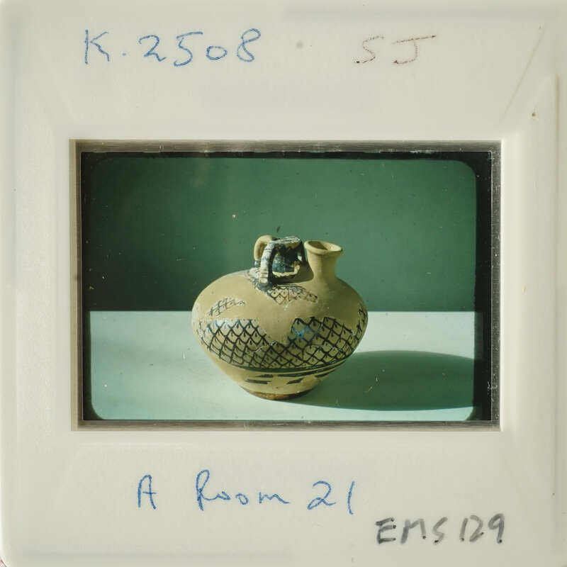 Ancient vase with intricate designs on display.