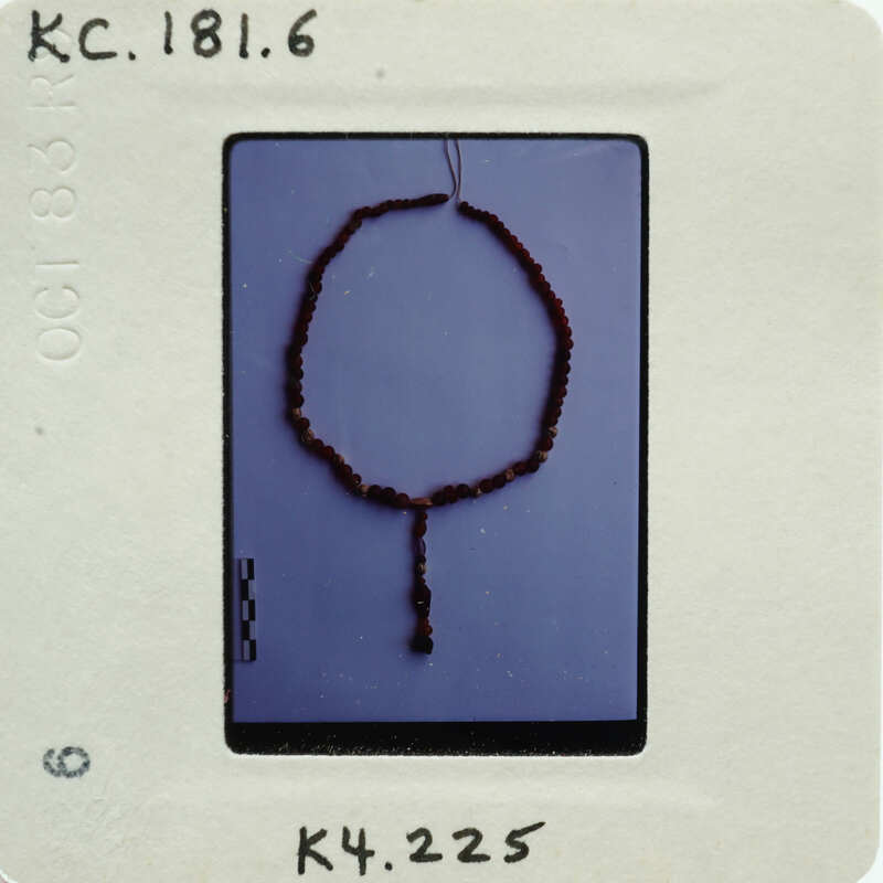 A close-up photograph of a string of beads.