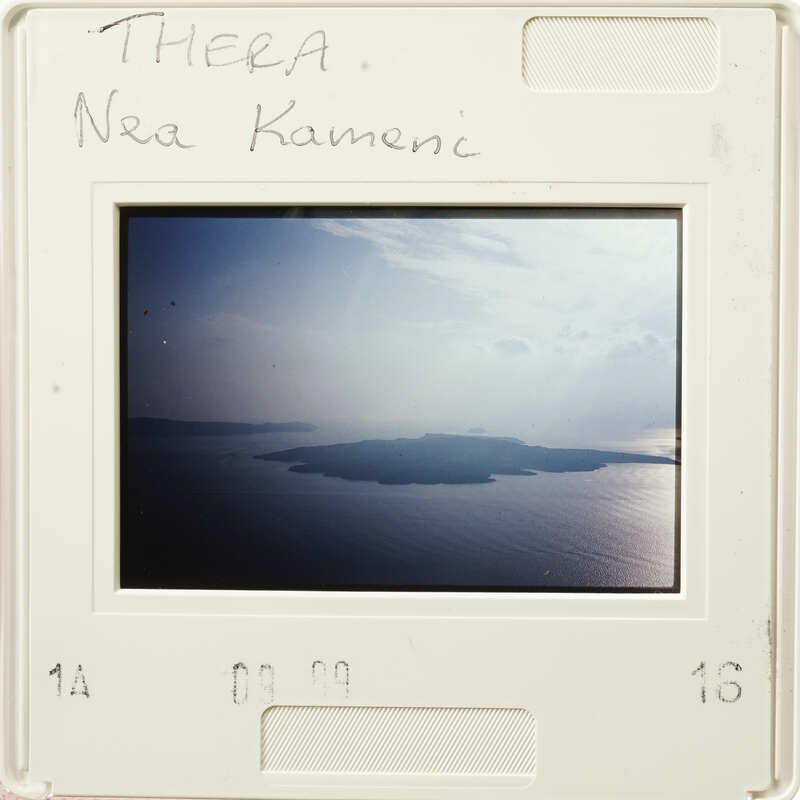 Landscape photograph with clouds and an island in the background.