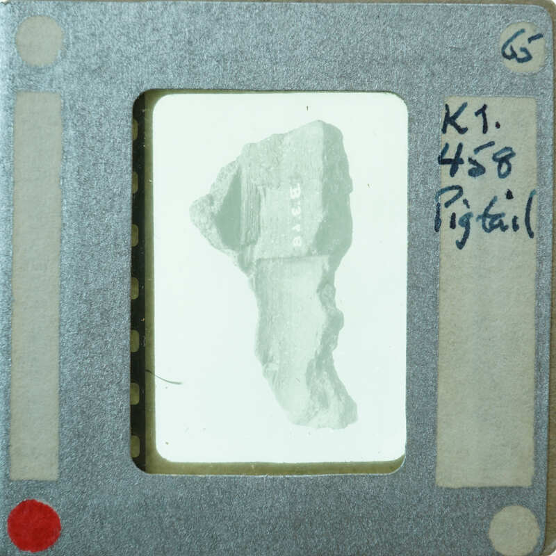 Terracotta figurine hair braid from interior K1.458.