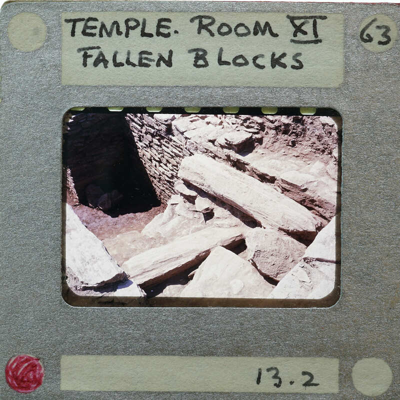 A photograph of a temple room with fallen blocks, presented on an old-fashioned film strip.