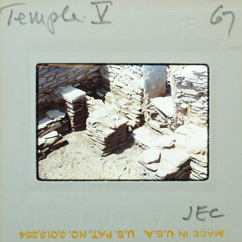 Stone walls and muddy floor.