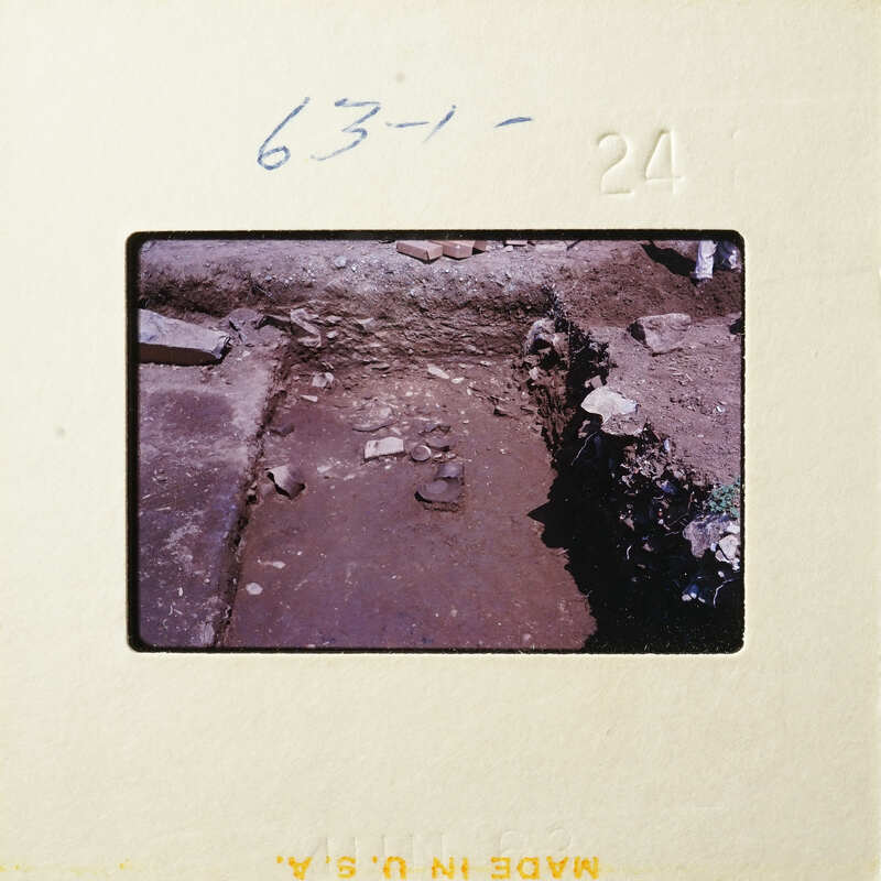 A photograph showing an excavation site with exposed dirt and rocks.