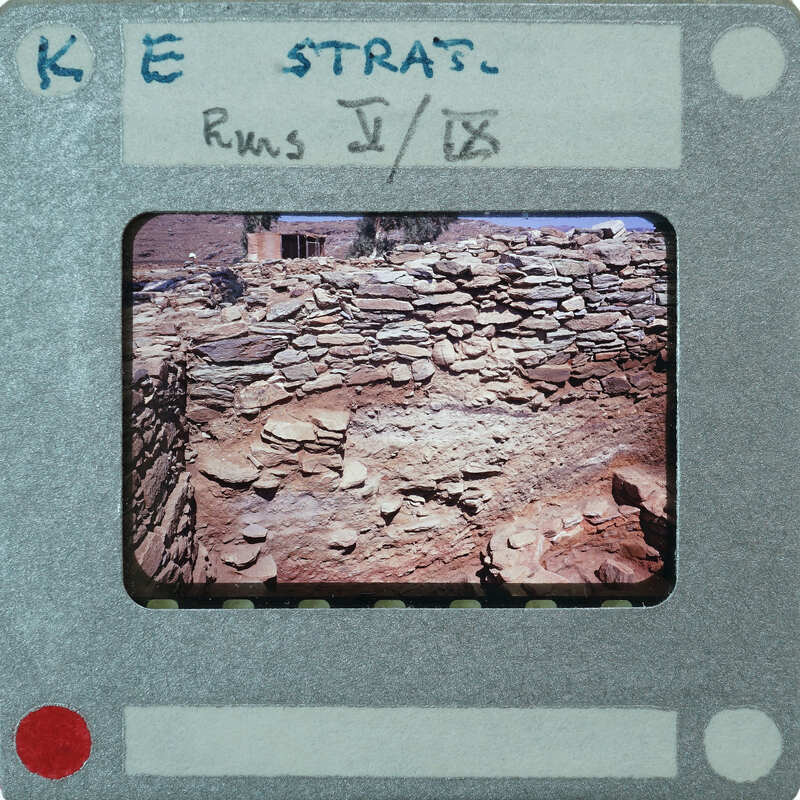 An image of a stone wall with a vintage film strip border and text indicating the photographer's name, location, and date.