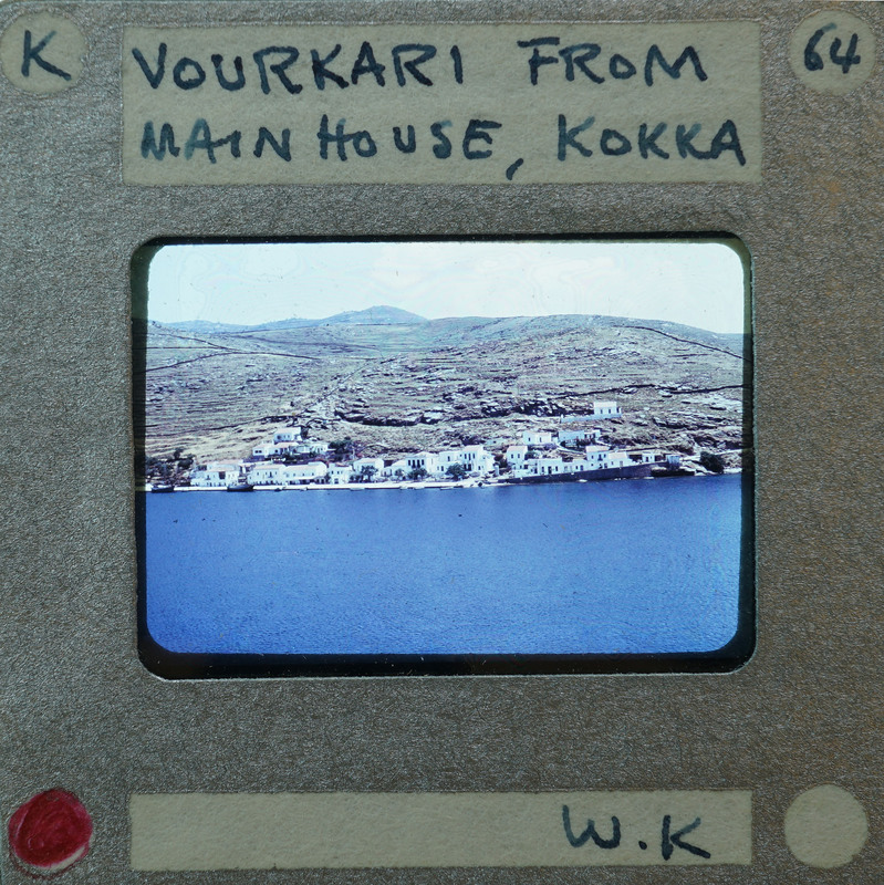 Photo of a village on the water with a label and handwritten notes.