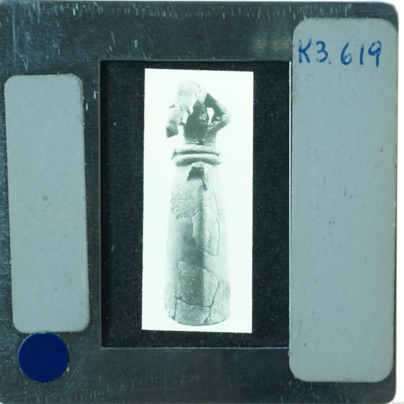 Headless restored terracotta figuring from front.