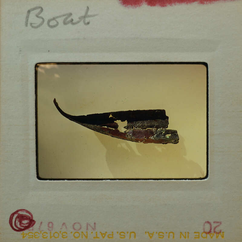 Small metal fragment of what looks to be the hull of a boat.