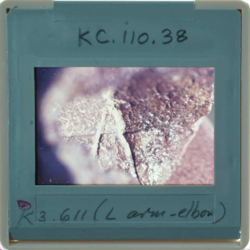 Details of terracotta figuring part showing clay with incised lines.