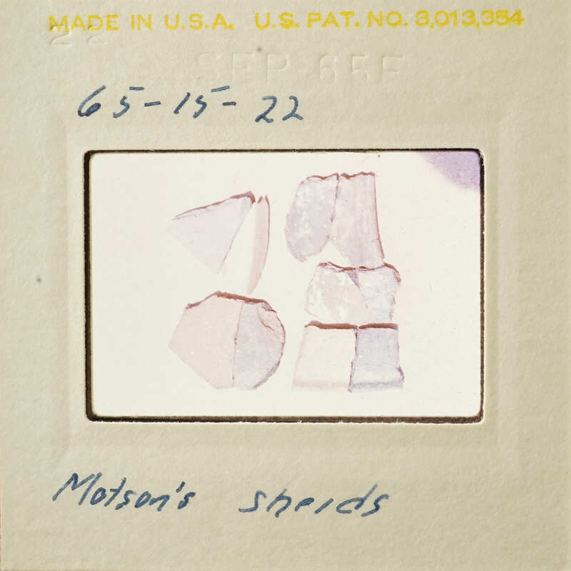 A collection of Monton's shards on a white background, with a label and handwritten notes.