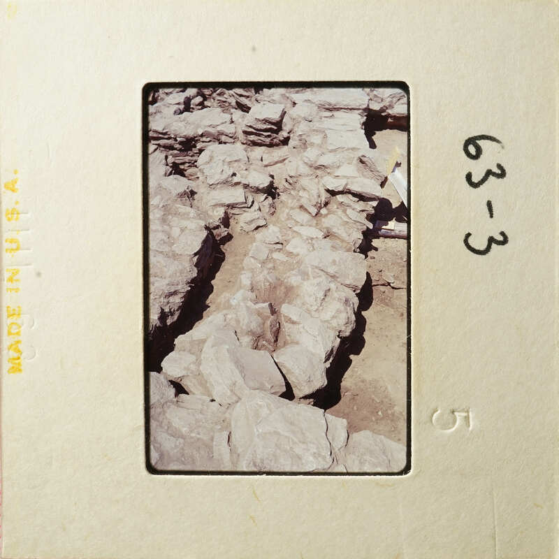 Photo of rocky terrain with natural formations, possibly part of an archaeological site.