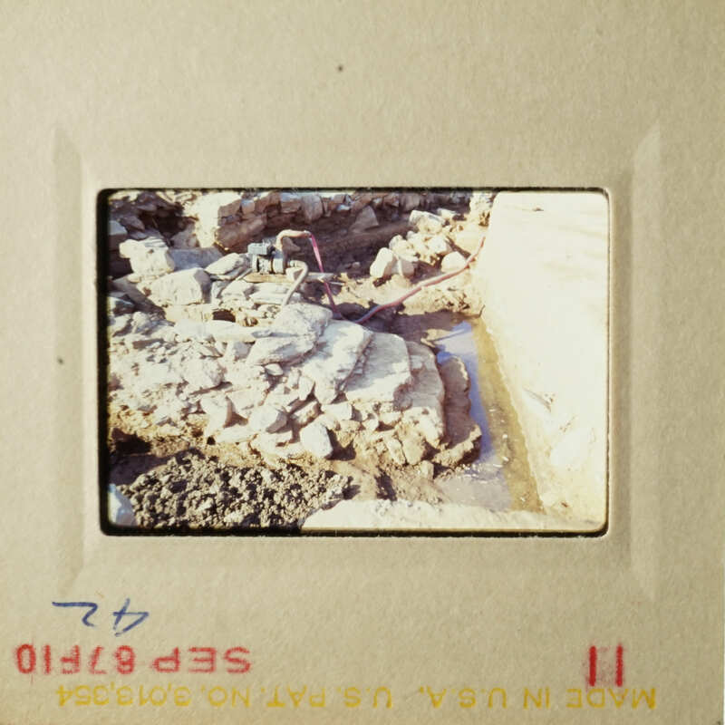Two vintage photos showcasing a construction site with dirt and rocks, possibly from an archaeological dig.