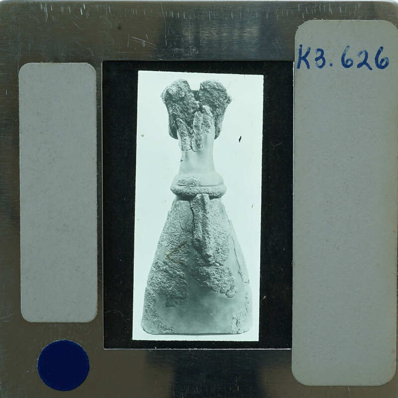 An old photo of a statue on film strip.