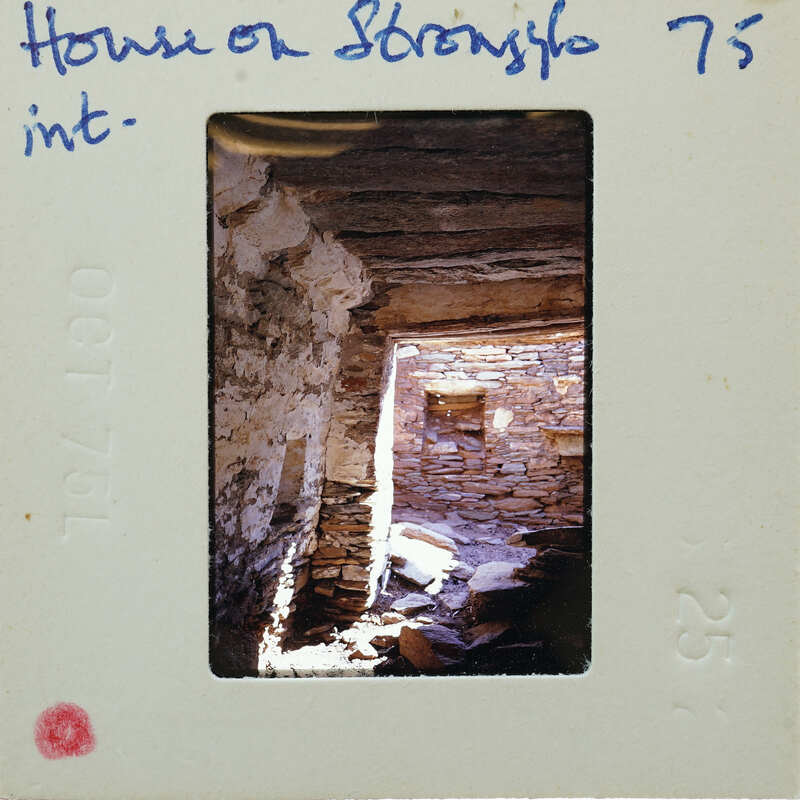 Picture of a cave with sunlight streaming through an opening, on a film strip.