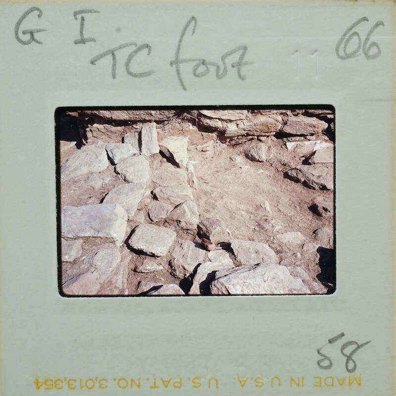 A photograph of a rocky surface with annotations on the border.