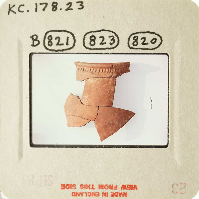 Ancient pottery fragment on display.