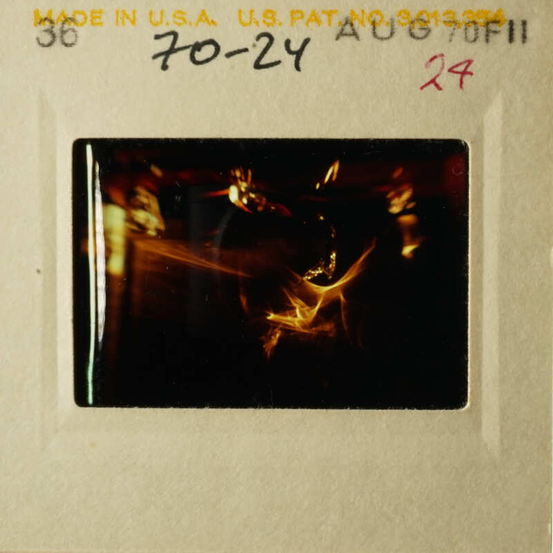 This is an old photograph depicting a black and white scene, possibly related to a specific event or subject matter, as indicated by the visible text on the slide.