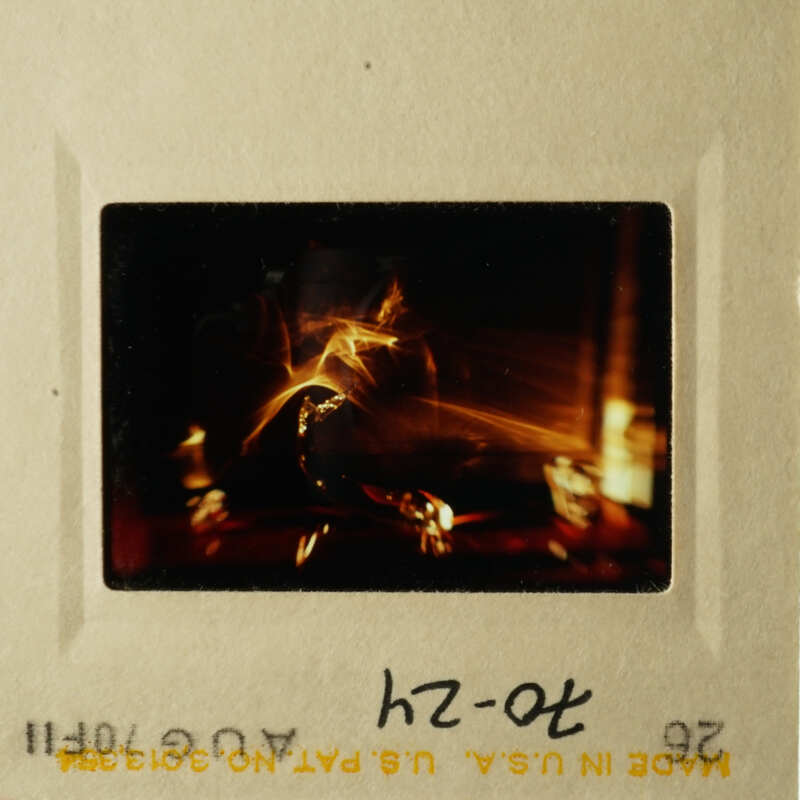 A photo with a candlelit scene, possibly a religious or ceremonial event.