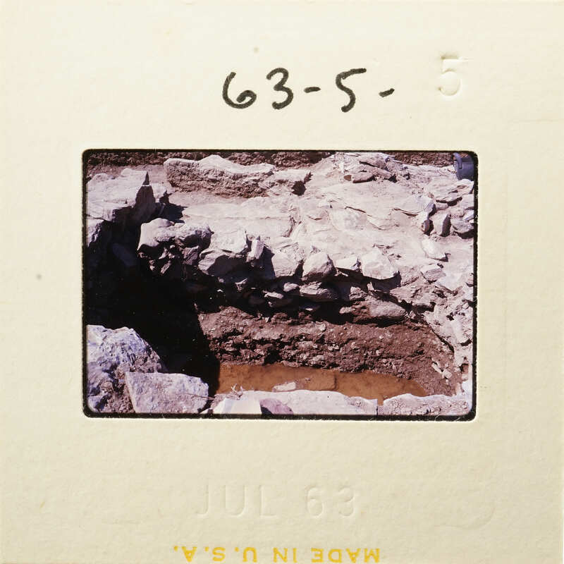 A photograph showing an excavation site with exposed rocks and earth.