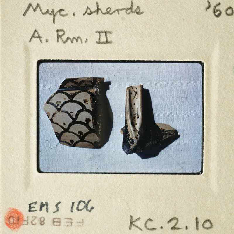 Two ancient clay objects, possibly pottery pieces with intricate designs and patterns.