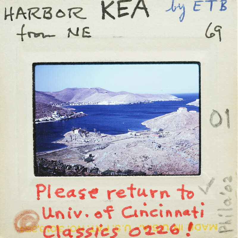 Photograph of a harbor with mountains and water, overlaid with handwritten notes and a return address to the University of Cincinnati.