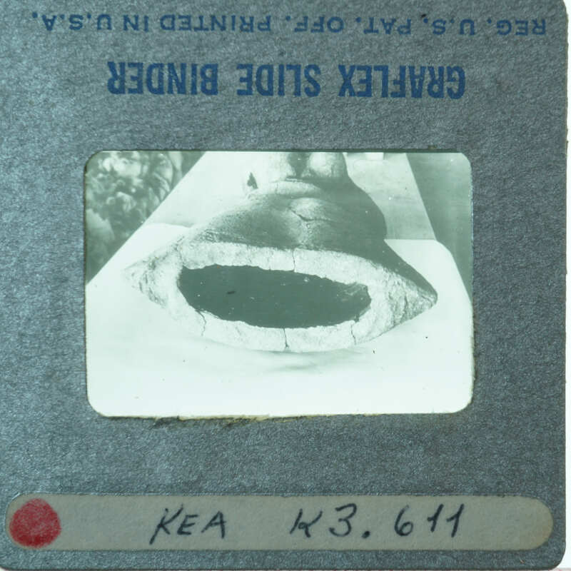 Bottom of terracotta figurine showing round skirt base.