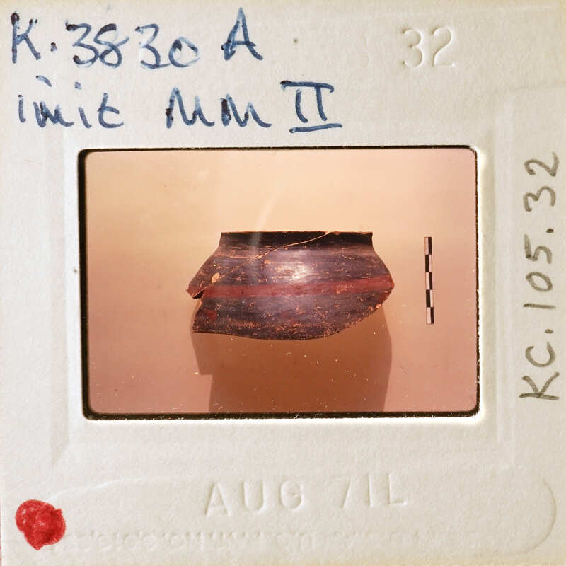 Picture of a film strip with an image of a rock and writing on it.