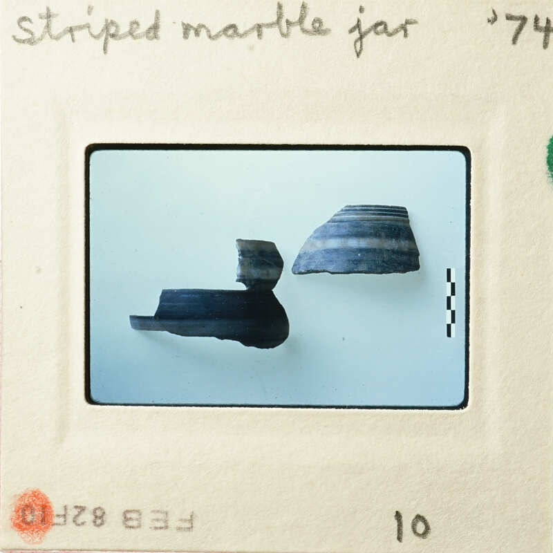 Ancient pottery displayed on a white background.