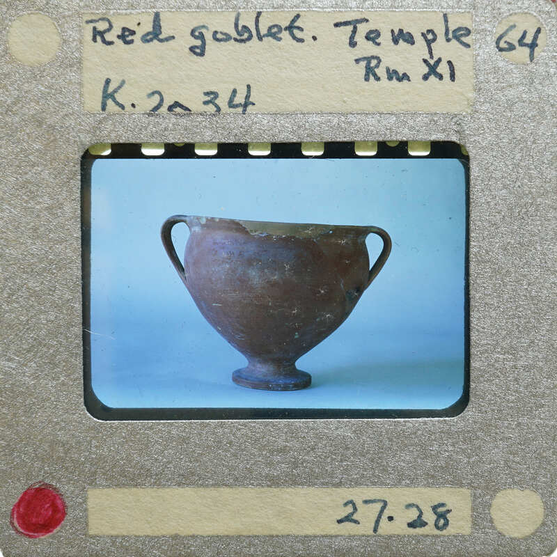 Reassembled red goblet with two handles in profile, K.2034.