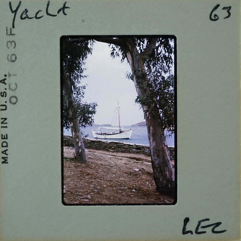 A vintage photo of a boat on the water with trees and a stone wall, labeled "Yacht" and "Lee".