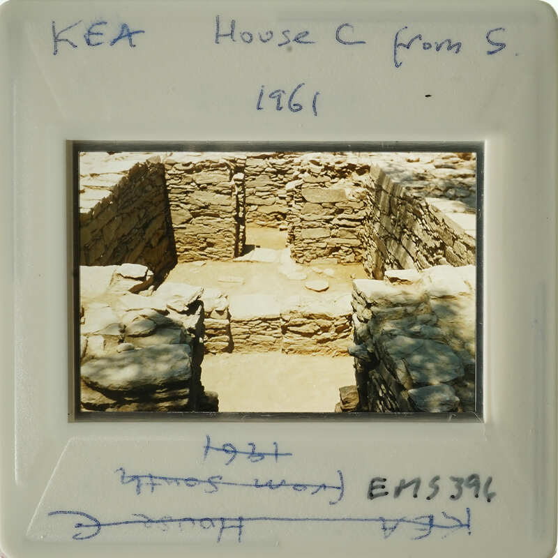 Old photograph of an archaeological site with stone ruins, possibly from a historical building or structure.