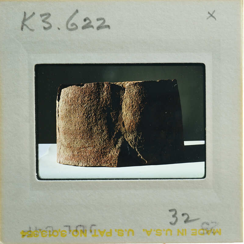 Broken base of terracotta figurine skirt.