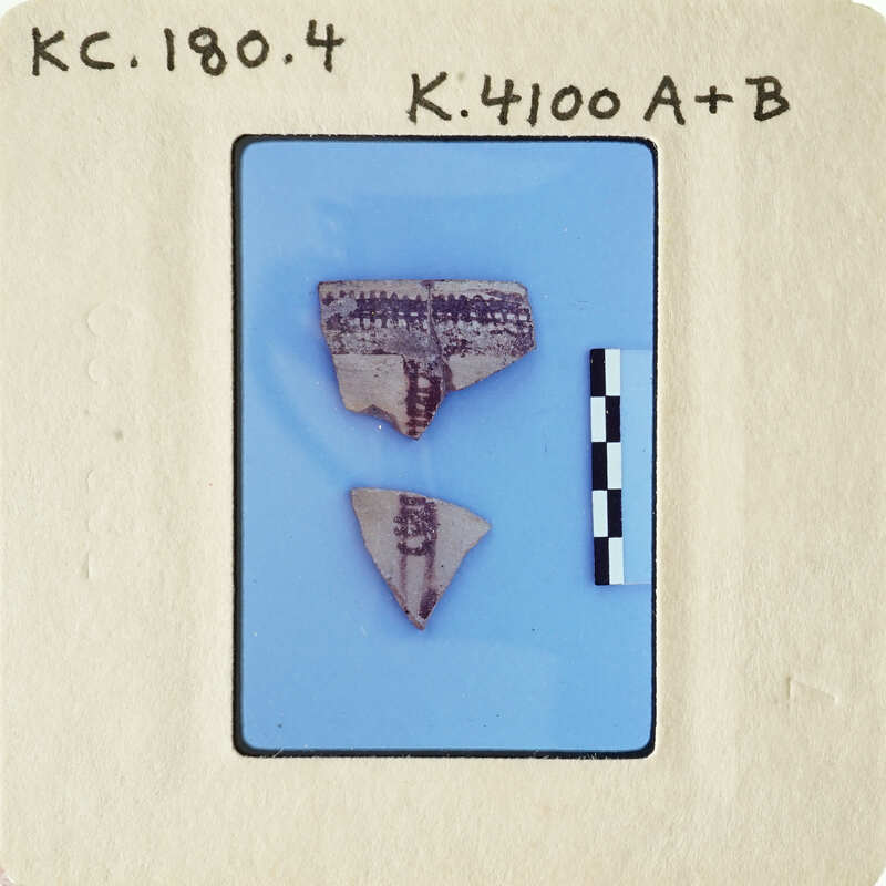 Two ancient pottery shards with visible designs on them, displayed against a blue background with labels and measurements.